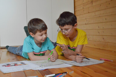 Two children doing school work at home together